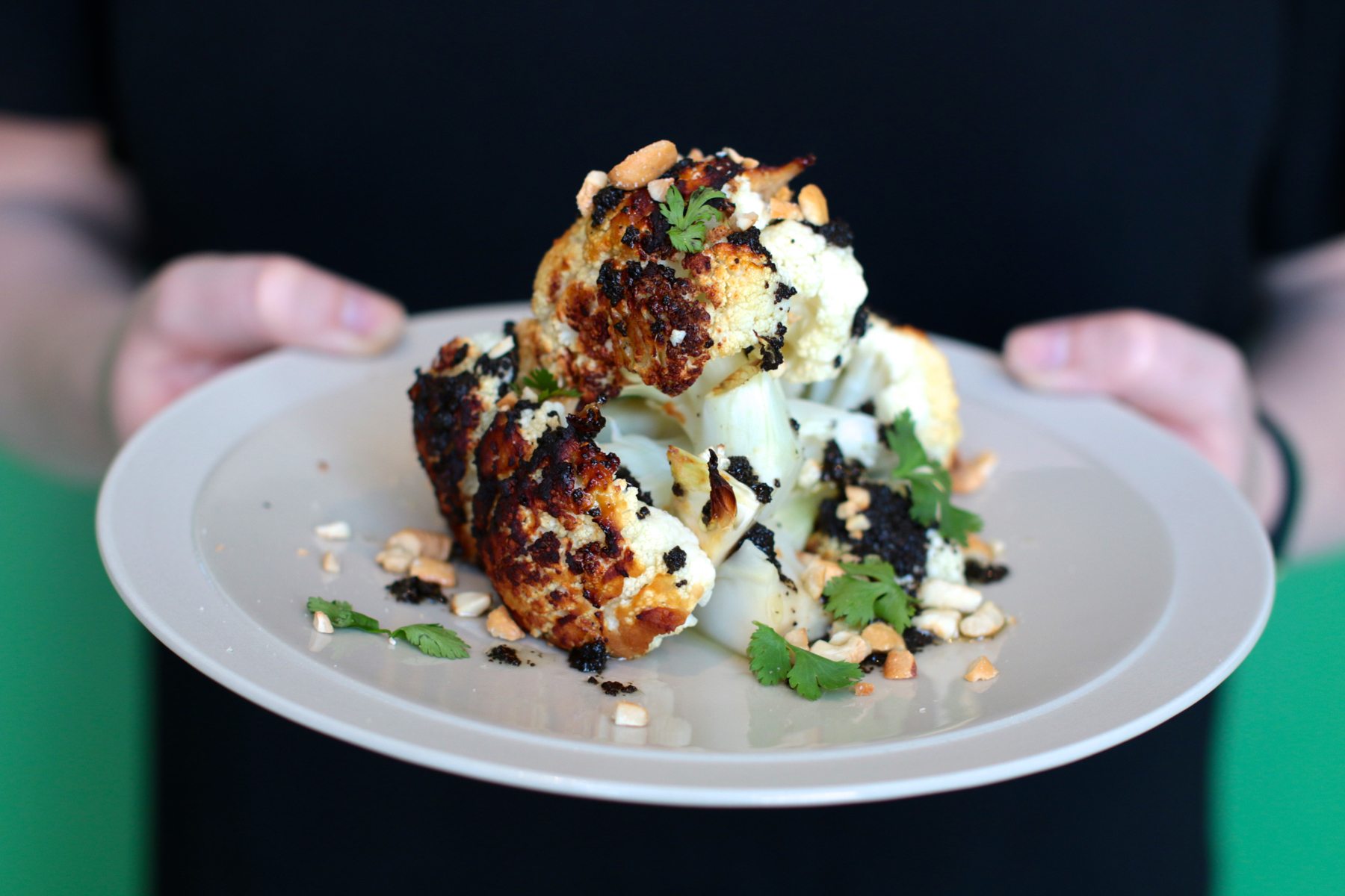 The miso cauliflower is marinated for two days before being slathered in black garlic and tossed in the oven. The florets are then topped with roasted cashews, parmesan and cilantro. $5.