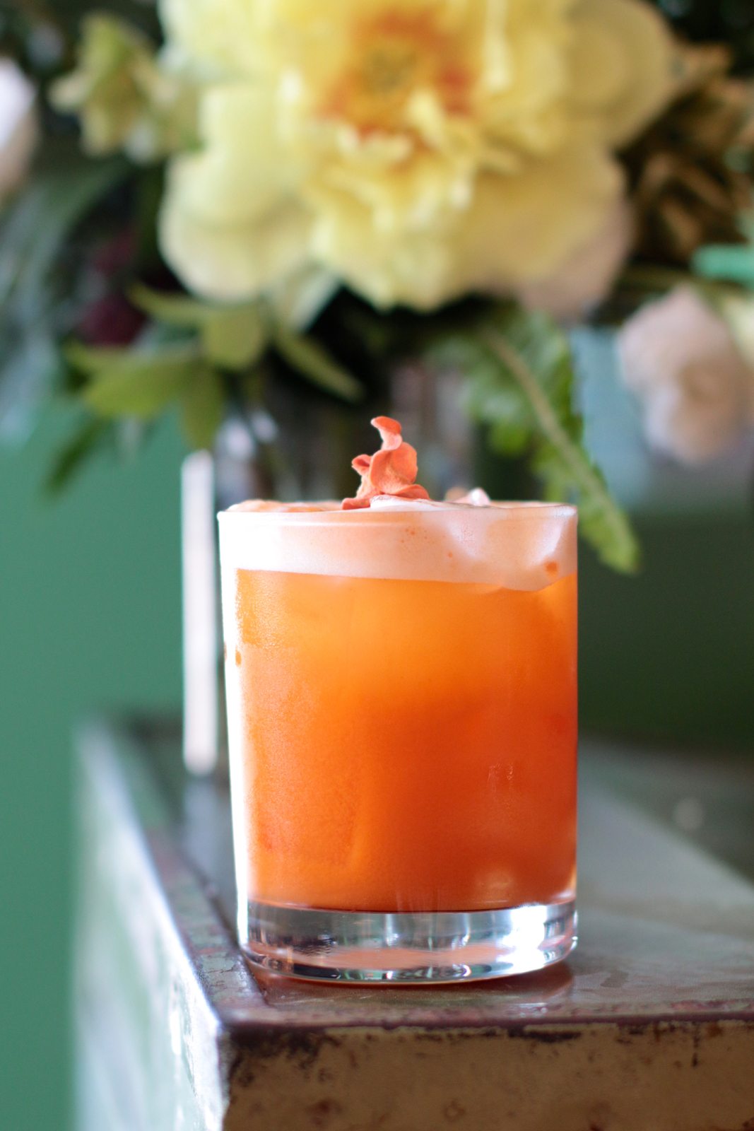 The Queen Street Sour is a mix of Gooderham & Worts Whisky and carrot-apple-tumeric-lemon juice, topped with a chickpea-derived vegan foam. $15.