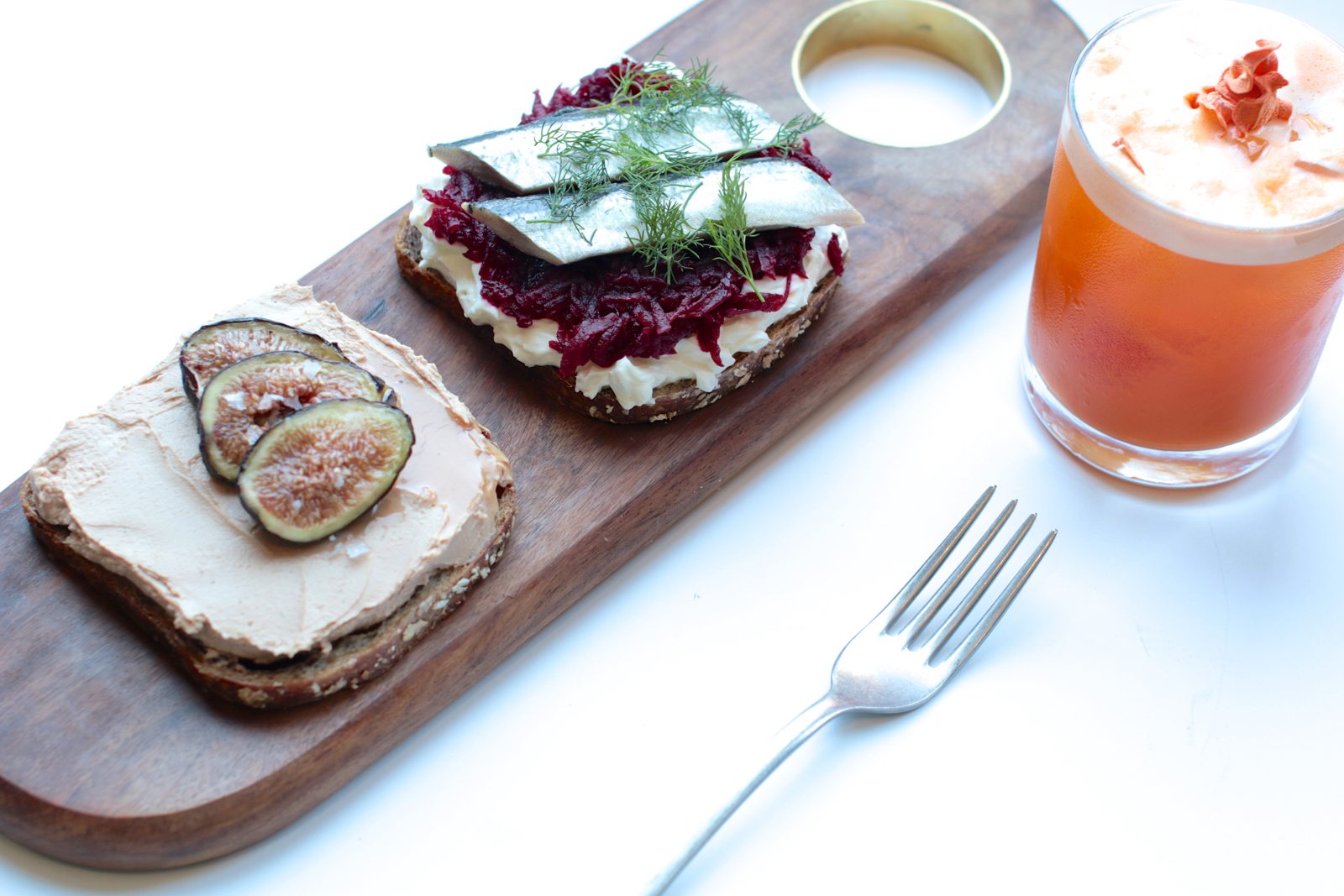 Danish smørrebrød are served on 90 per cent stone-milled rye bread. Pictured here are the brandy-infused duck liver pate with figs, honey and fleur de sel (left), and the house-pickled herring on beets and thick cream. $7 each.